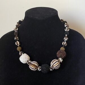 About Color handmade ball seed beads necklace. Made in Indonesia